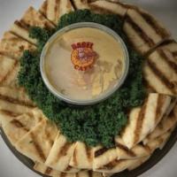 Hummus Platter Tray · Your choice of two hummus flavors. Served with pita chips. Vegetarian.