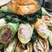 Catering Wrap Platter · Assorted wraps served with your choice of 3 side salads.