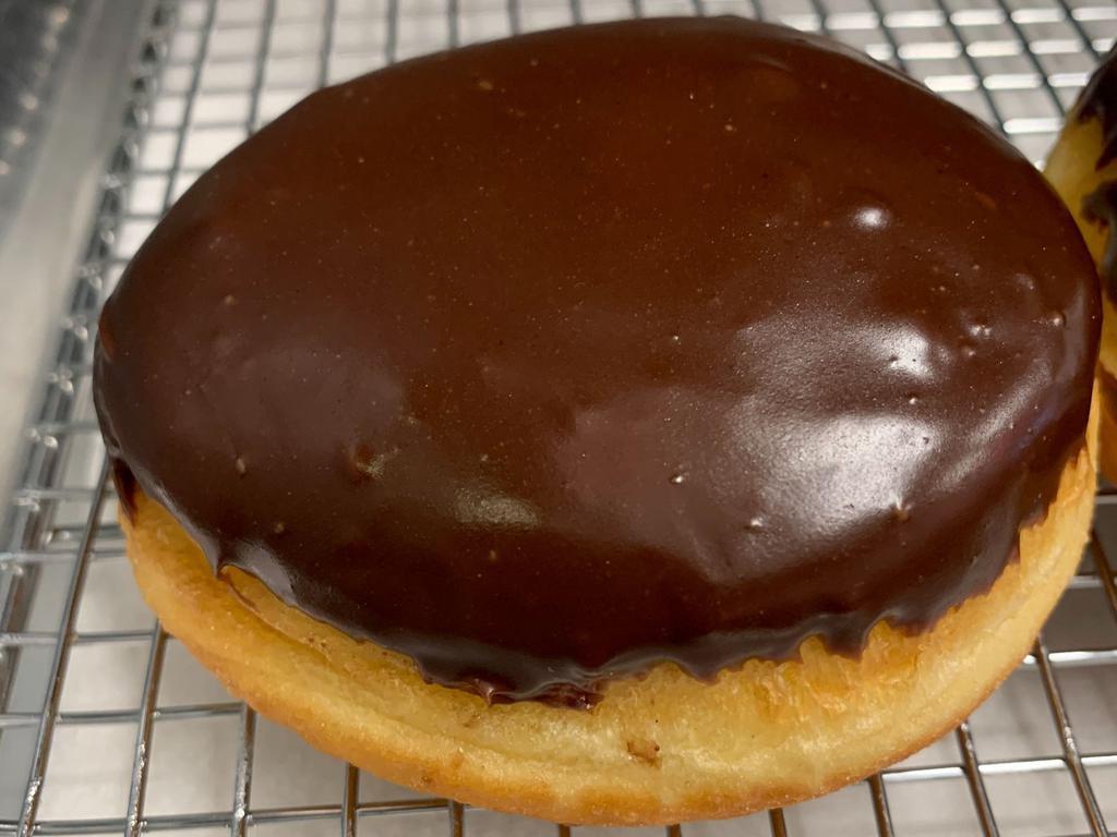Boston Cream of the Crop · Yeast donut filled with bavarian cream and topped with chocolate icing