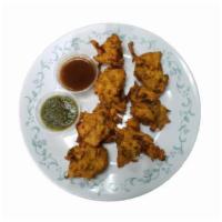 Mixed Vegetable Pakoras · Gluten free fresh vegetable mixed with chickpea batter and fried, served with mint chutney a...
