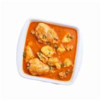 Chicken Curry · A savory curry cooked with traditional Indian spice. Contains dairy.