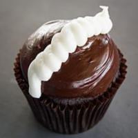 Chocolate Cream Cupcake · Chocolate cake filled with our signature buttercream topped with our signature fudge frostin...