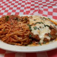 Veal Parmigiana · Lightly breaded veal cutlets served with marinara sauce, mozzarella cheese and a side of spa...
