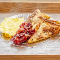French Toast · Two slices of grilled French toast served w/ two scrambled eggs