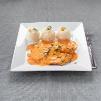 Tilapia Cream · Tilapia filet pan-seared and served over pink lobster sauce with rice and fried onions.