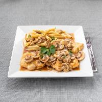 Chicken Marsala · Chicken breast sauteed with fresh mushrooms in marsala sauce. Served with pasta and bread.