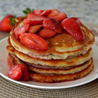 PANCAKES WITH FRESH STRAWBERRY · fresh strawberry,maple syrup,powder sugar(add toppings)