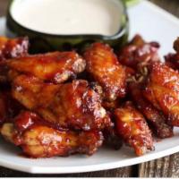 MANHATTAN BARBECUE WINGS · Wing saturated in a sweet and tangy barbecue sauce.