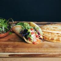 The Tree of Life Pita Sandwich · Roasted red peppers, avocado, mixed greens, tomato, house made pickled onions, housemade veg...
