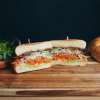 The Guac & Mole Sandwich · Avocado, vegan mole, clover sprouts, shredded carrots, cucumber, vegan ranch dressing, lemon...