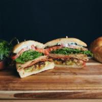 The Vegucated Order Sandwich · Everything you love about the RSTLNE plus oven-roasted tofurky and avocado on a ciabatta. Ve...