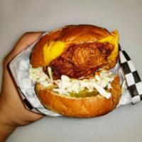 Nashville Hot Chicken Sandwich · Nashville style juicy fried chicken tenderloin topped with American cheese, pickles, and our...