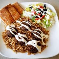Falafel Skewer · Served over rice with salad, creamy garlic sauce, hot sauce, and naan bread.