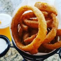 Onion Rings · Thick-sliced onions battered, deep-fried, and served with creamy Ranch dressing.