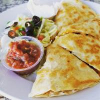 Chicken Quesadilla · Fresh tortillas stuffed with grilled chicken, tomatoes, green onions, green chilies & chedda...