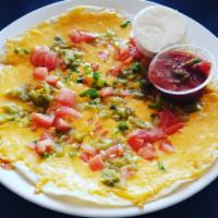 Cheese Crisp · Flour tortilla smothered with cheddar cheese, green chiles, scallions, & tomatoes. Served wi...