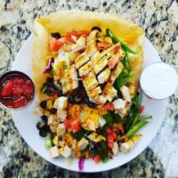 Chicken Fajita Salad · Marinated strips of chicken, peppers, onions, cheese, black olives, tomatoes, sour cream, & ...