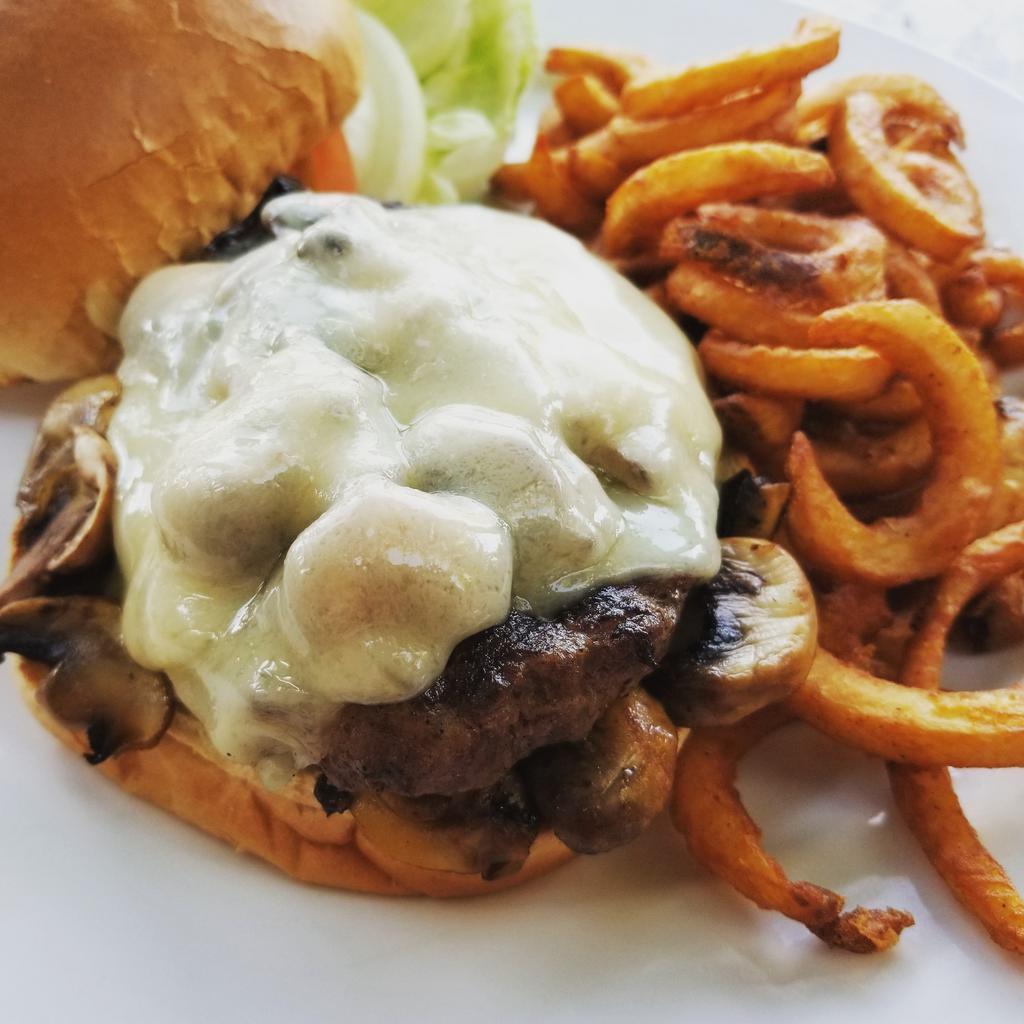 Mushroom Burger · Big juicy burger smothered with mushrooms & covered with melted Swiss cheese. Served with your choice of French fries or housemade coleslaw. Upgrade to any House Side for an additional $4. Gluten Free Bun $1.50
