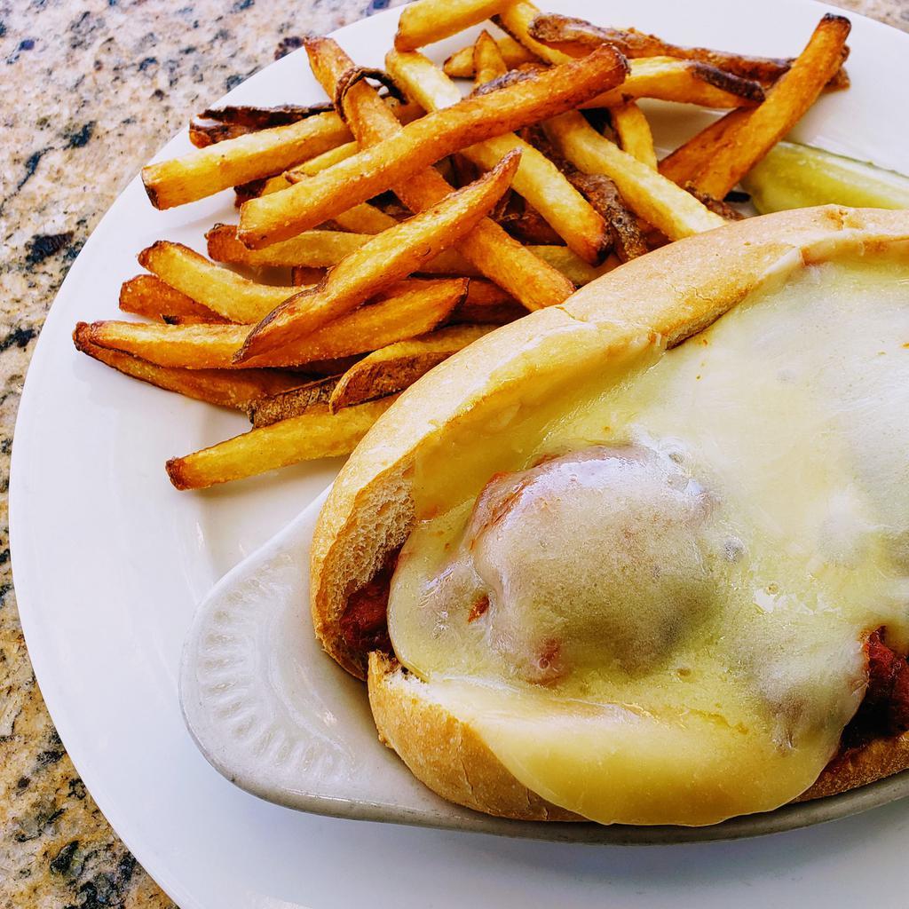 Italian Meatball Sandwich · Tasty meatballs with marinara, sautéed bell peppers, & provolone cheese, broiled to perfection on an Italian roll. Served with your choice of French fries or housemade coleslaw. Upgrade to any House Side for an additional $4. Gluten Free Bun $1.50
