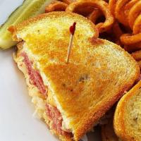 Reuben Sandwich · Flavorful corned beef, Swiss cheese, sauerkraut, & 1000 Island dressing stacked on toasty ry...
