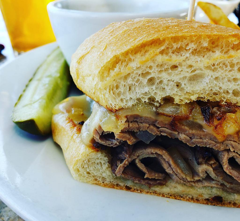 French Dip Sandwich · Slices of roast beef topped with onions & swiss cheese served on a French roll with a side of au jus. Served with your choice of French fries or housemade coleslaw. Upgrade to any House Side for an additional $4. Gluten Free Bun $1.50
