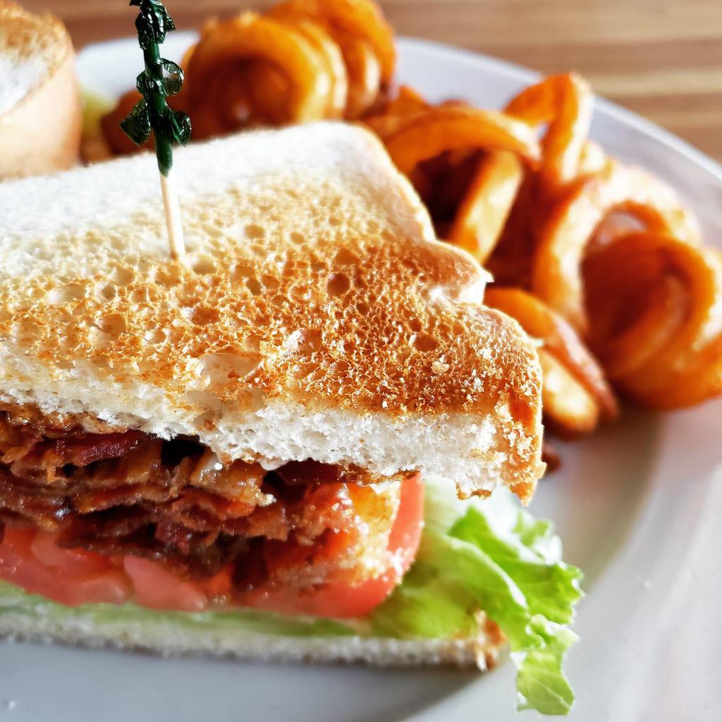 The Super BLT Sandwich · Crispy bacon, lettuce, tomato, and mayo piled high on your choice of white, wheat, rye, or sourdough bread. Served with your choice of French fries or housemade coleslaw. Upgrade to any House Side for an additional $4. Gluten Free Bun $1.50