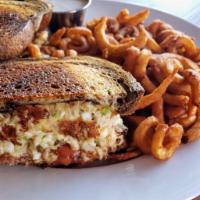 Tuna Melt Rye Sandwich · Fresh tuna salad on toasted rye bread, topped with tomato & melted Cheddar cheese. Served wi...