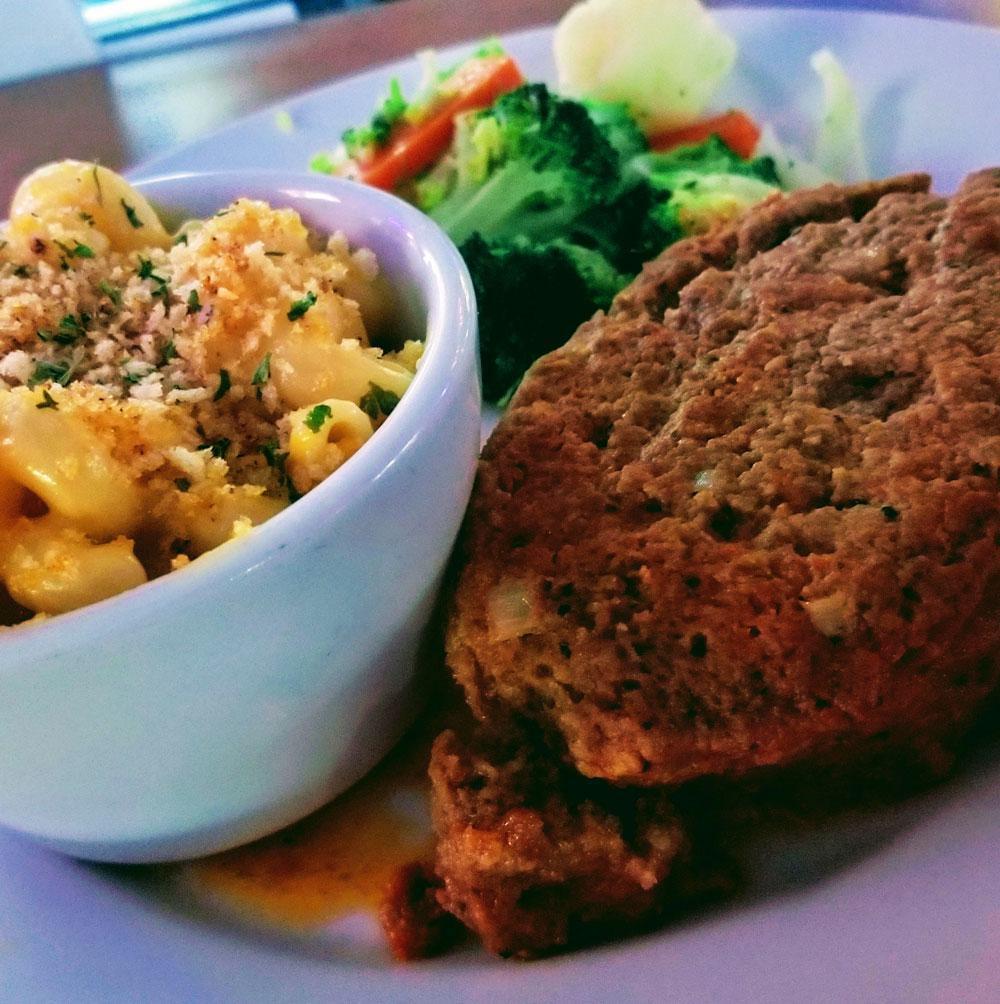 Homestyle Meatloaf · Our own housemade meatloaf served with seasonal vegetables and baked potato or garlic mashed potatoes. Swap your potato side for any House Side for an additional $4. 
