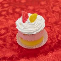 Raspberry and Lemon Mousse Baby Cake · Layers of moist vanilla caked filled with zesty lemon custard, raspberry cream, and finished...