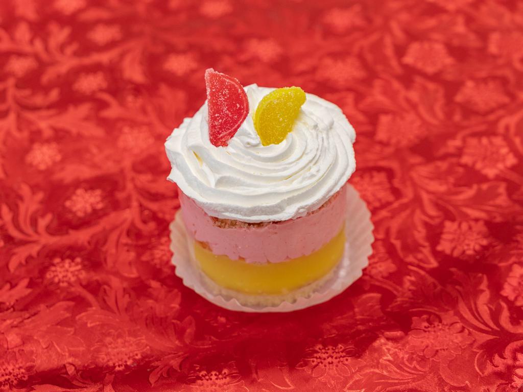 Raspberry and Lemon Mousse Baby Cake · Layers of moist vanilla caked filled with zesty lemon custard, raspberry cream, and finished in French vanilla buttercream.