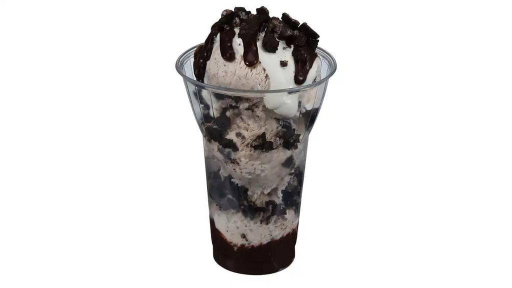 Oreo Layered Sundae · 3 scoops of our Oreo cookies n cream Ice cream layered with hot fudge and chopped Oreo cookie pieces topped with marshmallow, more hot fudge and Oreo cookie pieces.
