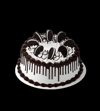 OREO Cookie Cake · Attention cookie and ice cream lovers - OREO® Cookies circle the top of this deliciously frosted cake, drizzled in dark chocolate and edged with a fudge border.