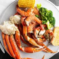 King Crab Platter · Includes 2 snow crab leg clusters, king jumbo shrimp, dungeous crab claws, 2 sides and garli...