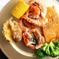 King Salmon Platter · Includes salmon, king shrimp, dungeous crab claws, 2 sides and a garlic bread.