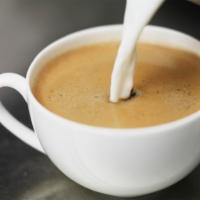Café Au Lait · Our fresh brewed drip coffee with added steamed milk.  Similar to a Latte but made with brew...