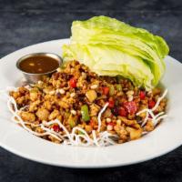 CHICKEN LETTUCE CUP · Minced chicken, water chestnuts,
mushrooms, and bell peppers on crispy
rice noodles. Served ...