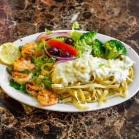 Shrimp Alfredo · Grilled shrimp on fettuccini pasta with Alfredo sauce and broccoli. Served with house salad,...