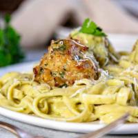 Meatball Alfredo · Beef meatball on fettuccini pasta with Alfredo sauce and broccoli. Served with house salad a...