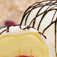 Exotic Bomba · Mango, passion fruit, and raspberry sorbetto all covered in white chocolate and drizzled wit...