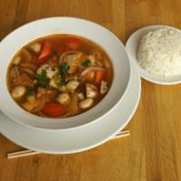 Large Thom Yum Soup · Thailand’s savory hot and sour soup with mushrooms, tomatoes, onions, cilantro, lime leaves,...