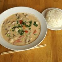 Small Thom Kha Soup · Creamy hot and sour coconut soup with mushrooms, tomatoes, onions, cilantro, lime leaves, le...