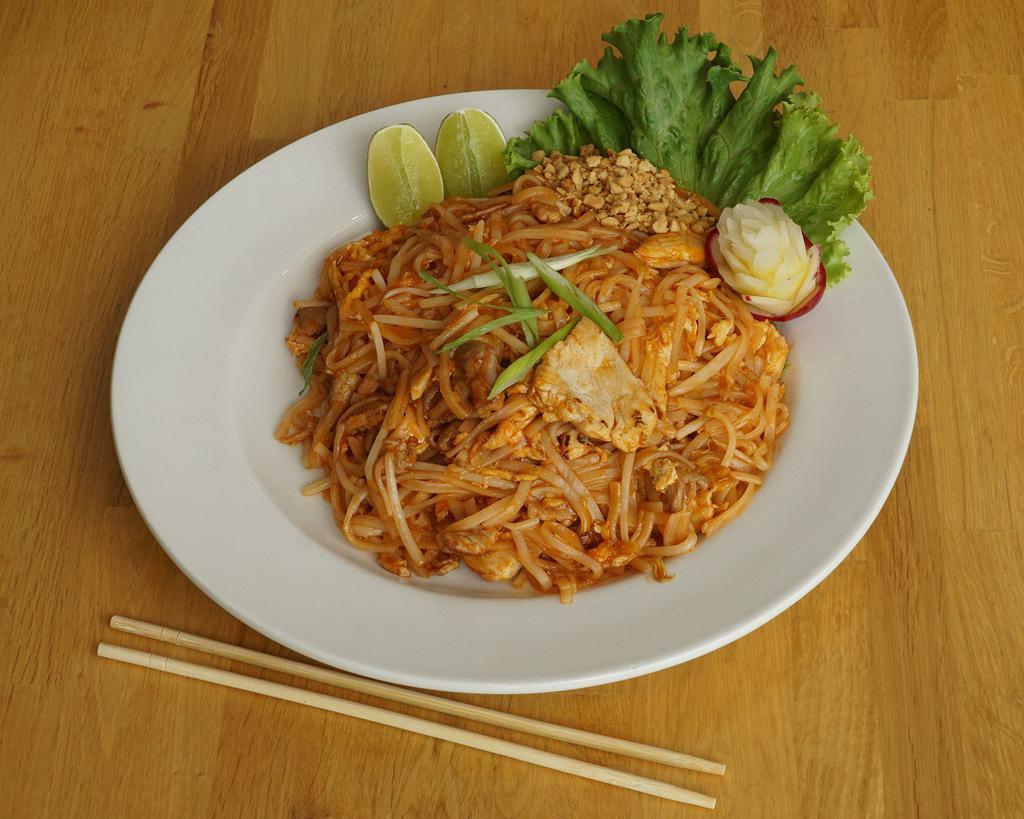 Pad Thai Stir Fry · A staple of every Thai restaurant, pad Thai is a stir-fried rice noodle, tangy pad Thai sauce, egg, green onions, and bean sprouts, crushed peanut, and line on the side. Gluten-free.