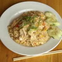 Thai Fried Rice · Thai jasmine rice blended with egg, onions, tomatoes and scallions.