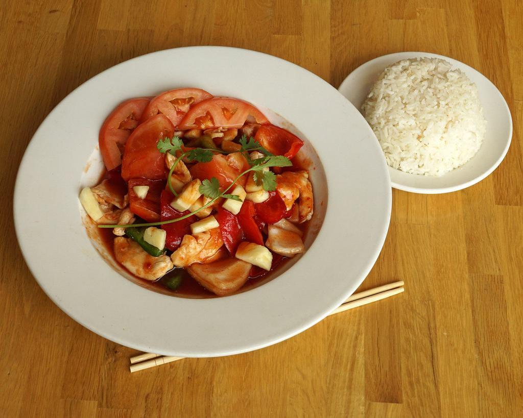 Pad Sweet and Sour · Onions, tomatoes, bell peppers, and pineapples stir-fried in a sweet and sour tangy sauce. Gluten-free.  Served with jasmine rice