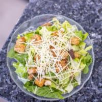 Caesar Salad  · Romaine lettuce, red onion, croutons, Parmesan cheese and Caesar dressing