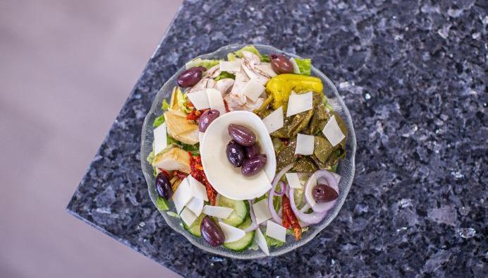 Agean Salad  · Romaine lettuce, cucumbers, red onions, mushrooms, artichoke hearts, sundried tomatoes, pepperoncini, Kalamata olives, roasted pepper, sharp provolone, with balsamic vinaigrette.