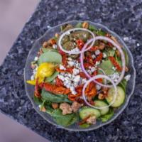 Spinach Salad · Baby spinach, candied walnuts, crumbled blue cheese, roasted peppers, sun-dried tomatoes, cu...