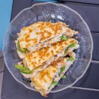 Chicken Quesadilla · Served with onions, peppers and cheese.