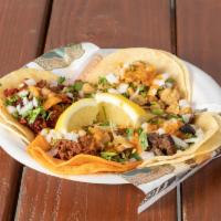Classic Street Tacos · Tortilla, onions, cilantro, salsa and meat of choice.