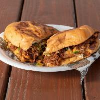 Classic Torta · Tellera bread filled with melted cheese, beans, and your meat choice.